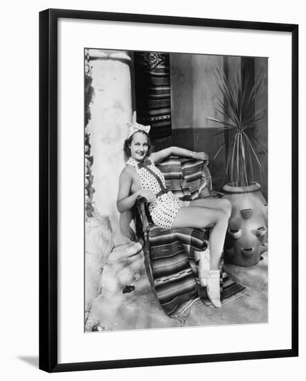 Young Woman in a Sun Suit Sitting on a Chair-null-Framed Photo