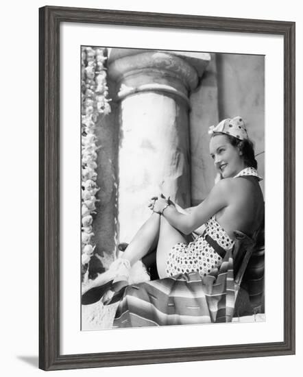 Young Woman in a Sun Suit Sitting on a Chair-null-Framed Photo