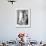 Young Woman in a Sun Suit Sitting on a Chair-null-Framed Photo displayed on a wall