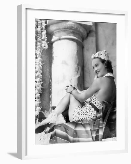 Young Woman in a Sun Suit Sitting on a Chair-null-Framed Photo