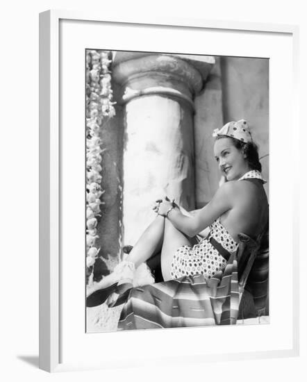 Young Woman in a Sun Suit Sitting on a Chair-null-Framed Photo