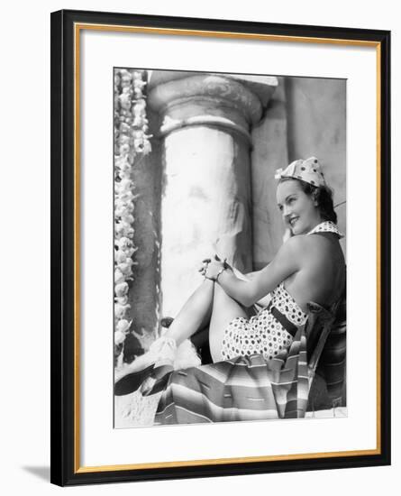 Young Woman in a Sun Suit Sitting on a Chair-null-Framed Photo