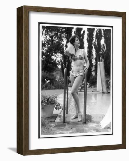 Young Woman in an Abstract Print Bikini with Broderie Anglaise Trim Towel Dries Her Hair-null-Framed Art Print