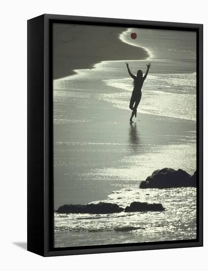 Young Woman in Silhouette Running Along Beach at Twilight Throwing Beach Ball Up in the Air-Co Rentmeester-Framed Premier Image Canvas