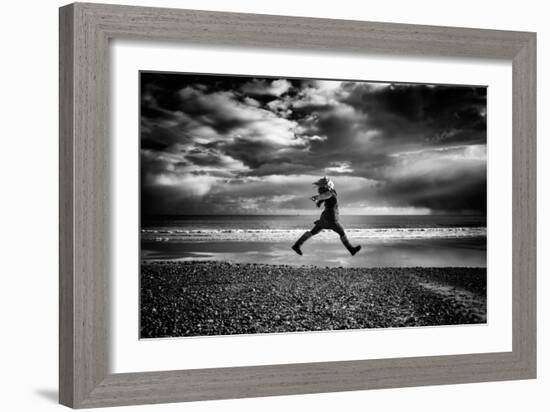 Young Woman Jumping on Beach-Rory Garforth-Framed Photographic Print