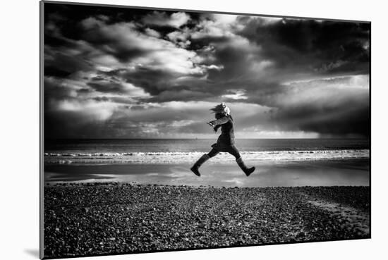 Young Woman Jumping on Beach-Rory Garforth-Mounted Photographic Print