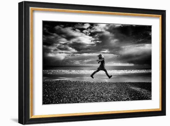 Young Woman Jumping on Beach-Rory Garforth-Framed Photographic Print