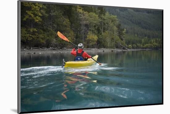 Young Woman Kayaking on Chilko Lake in British Columbia, Canada-Justin Bailie-Mounted Photographic Print