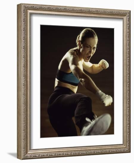 Young Woman Kickboxing-null-Framed Photographic Print