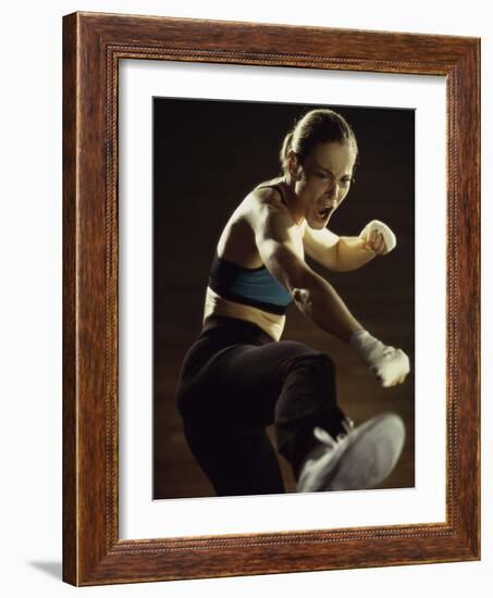 Young Woman Kickboxing-null-Framed Photographic Print