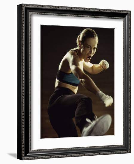 Young Woman Kickboxing-null-Framed Photographic Print