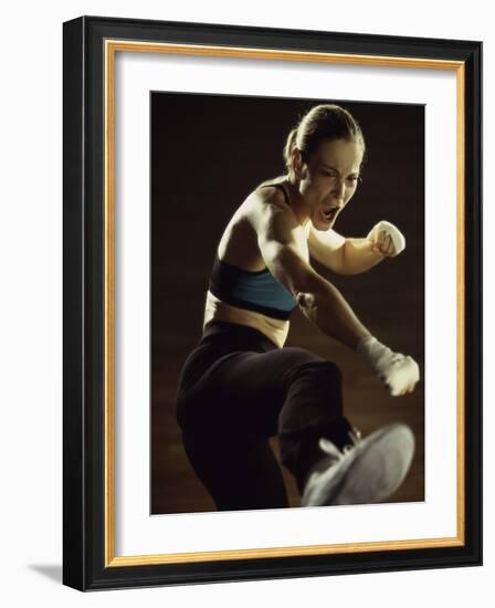 Young Woman Kickboxing-null-Framed Photographic Print