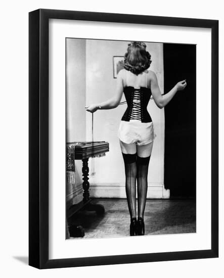 Young Woman Lacing Her Corset-Bettmann-Framed Photographic Print