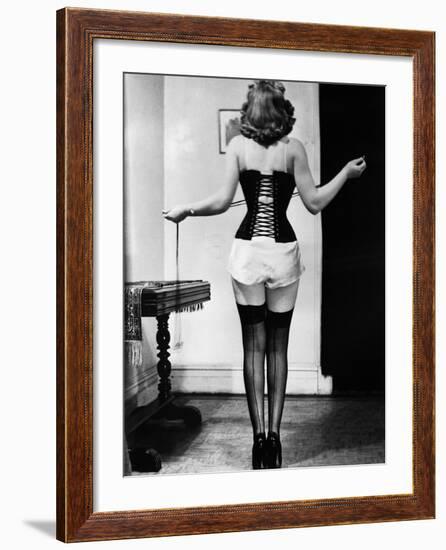 Young Woman Lacing Her Corset-Bettmann-Framed Photographic Print