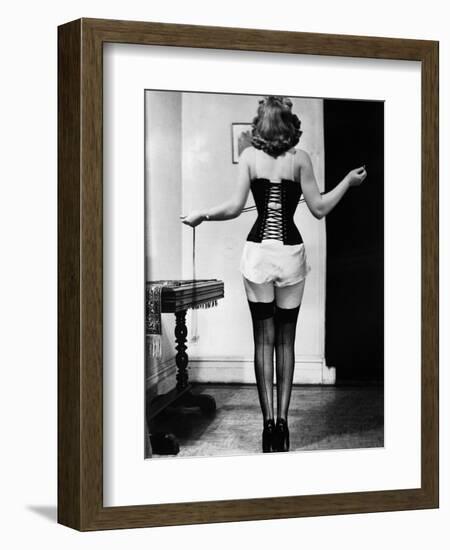 Young Woman Lacing Her Corset-Bettmann-Framed Photographic Print