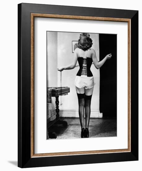 Young Woman Lacing Her Corset-Bettmann-Framed Photographic Print