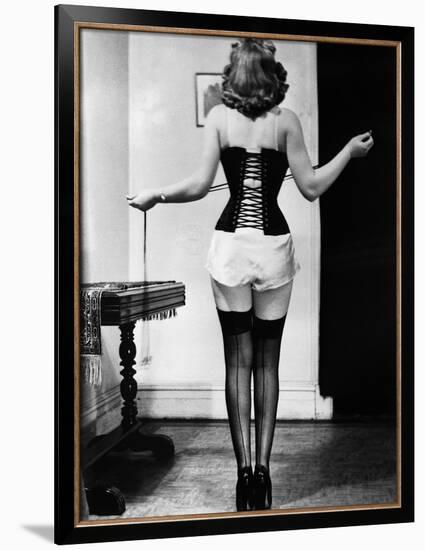 Young Woman Lacing Her Corset-Bettmann-Framed Photographic Print