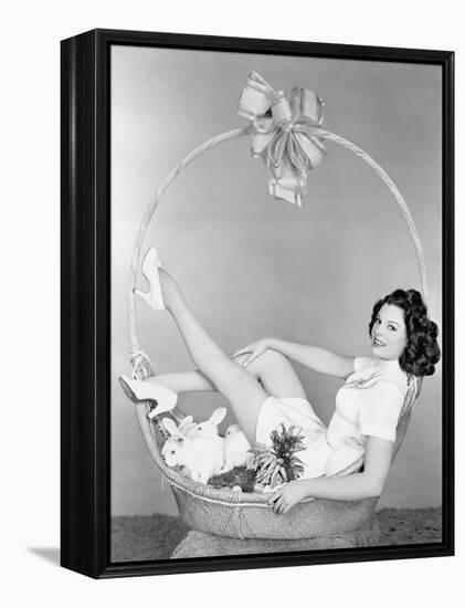 Young Woman, Looking Like a Present, Sitting in Gift Basket with Bunnies-null-Framed Stretched Canvas