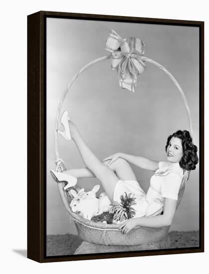 Young Woman, Looking Like a Present, Sitting in Gift Basket with Bunnies-null-Framed Stretched Canvas