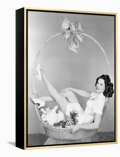 Young Woman, Looking Like a Present, Sitting in Gift Basket with Bunnies-null-Framed Stretched Canvas