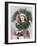 Young Woman Looking Through a Wreath with Presents in Front of Her-null-Framed Photo