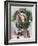 Young Woman Looking Through a Wreath with Presents in Front of Her-null-Framed Photo