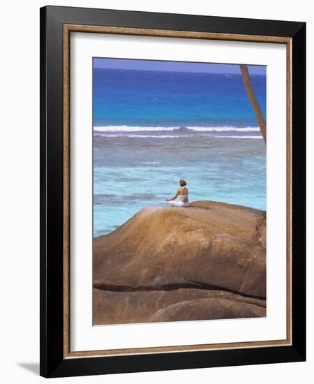 Young Woman Meditating on Rock, Seychelles, Indian Ocean, Africa-Sakis Papadopoulos-Framed Photographic Print