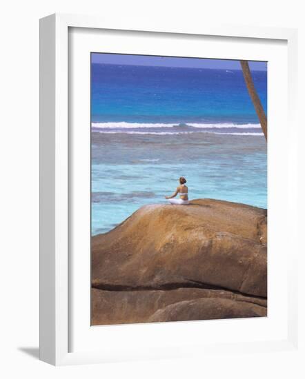 Young Woman Meditating on Rock, Seychelles, Indian Ocean, Africa-Sakis Papadopoulos-Framed Photographic Print