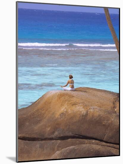 Young Woman Meditating on Rock, Seychelles, Indian Ocean, Africa-Sakis Papadopoulos-Mounted Photographic Print