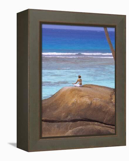 Young Woman Meditating on Rock, Seychelles, Indian Ocean, Africa-Sakis Papadopoulos-Framed Premier Image Canvas