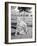 Young Woman on a Golf Course Placing a Golf Ball-null-Framed Photo