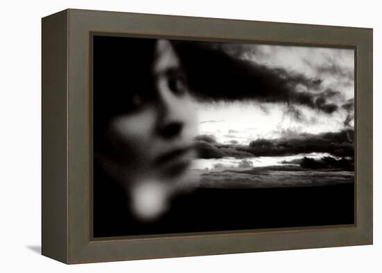 Young Woman Out of Focus in Front of Cloudy Sky Looking into the Camera-Torsten Richter-Framed Premier Image Canvas