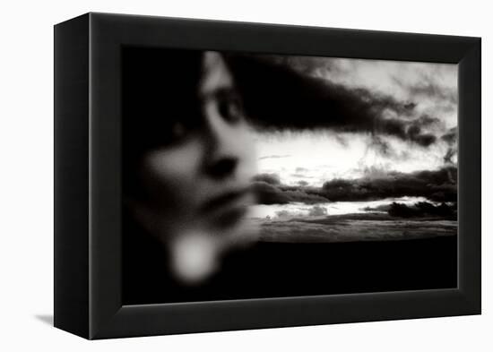 Young Woman Out of Focus in Front of Cloudy Sky Looking into the Camera-Torsten Richter-Framed Premier Image Canvas