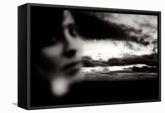 Young Woman Out of Focus in Front of Cloudy Sky Looking into the Camera-Torsten Richter-Framed Premier Image Canvas