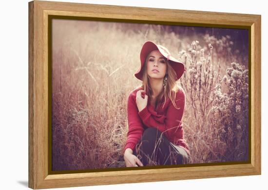 Young Woman Outdoors Wearing a Red Hat-Sabine Rosch-Framed Premier Image Canvas