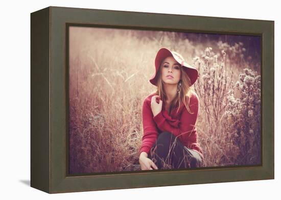 Young Woman Outdoors Wearing a Red Hat-Sabine Rosch-Framed Premier Image Canvas
