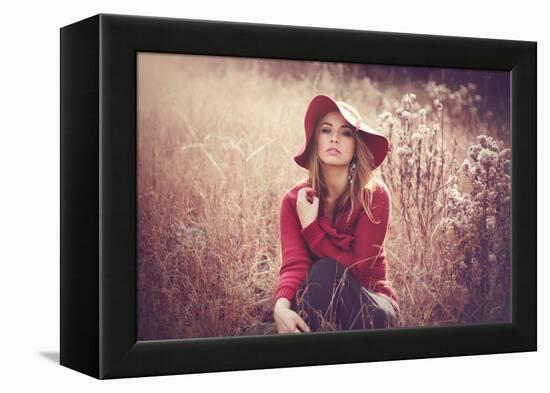 Young Woman Outdoors Wearing a Red Hat-Sabine Rosch-Framed Premier Image Canvas