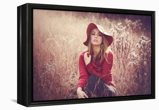 Young Woman Outdoors Wearing a Red Hat-Sabine Rosch-Framed Premier Image Canvas