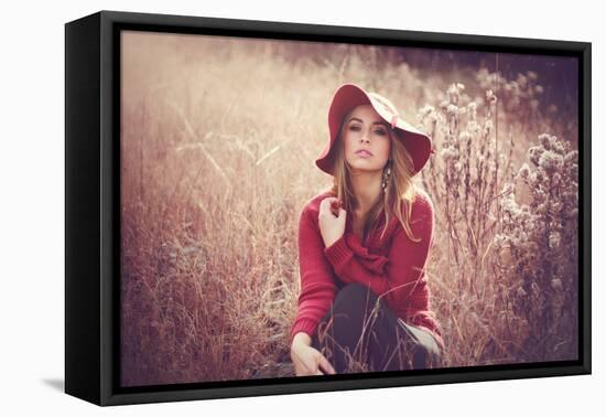 Young Woman Outdoors Wearing a Red Hat-Sabine Rosch-Framed Premier Image Canvas