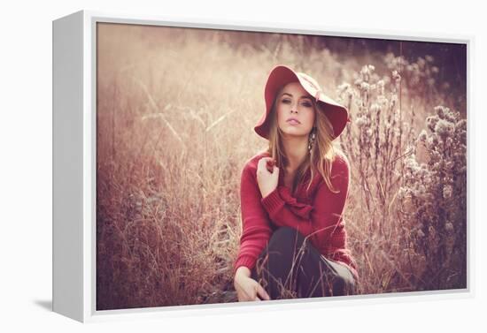 Young Woman Outdoors Wearing a Red Hat-Sabine Rosch-Framed Premier Image Canvas