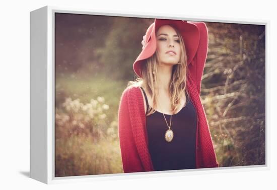 Young Woman Outdoors Wearing a Red Hat-Sabine Rosch-Framed Premier Image Canvas