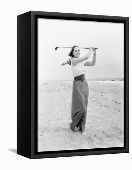 Young Woman Playing Golf at the Beach-null-Framed Stretched Canvas