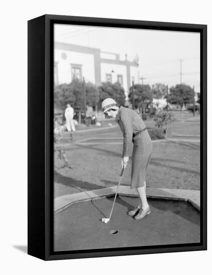 Young Woman Playing Mini Golf-null-Framed Stretched Canvas