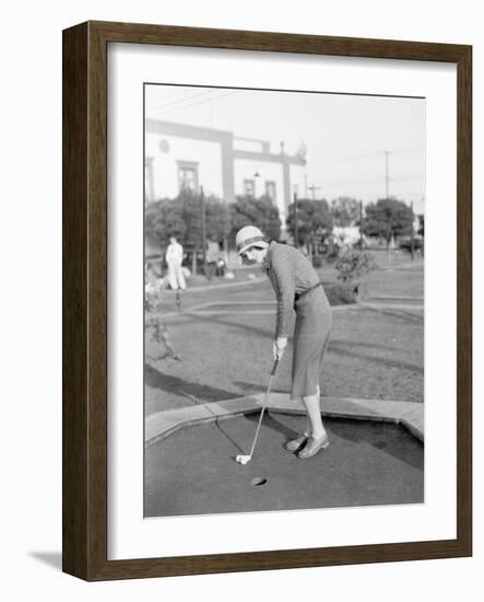 Young Woman Playing Mini Golf-null-Framed Photo