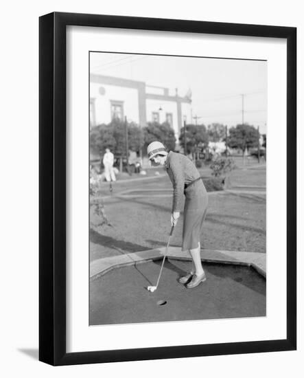 Young Woman Playing Mini Golf-null-Framed Photo