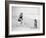 Young Woman Playing with Her Dog and Ball on the Beach-null-Framed Photo