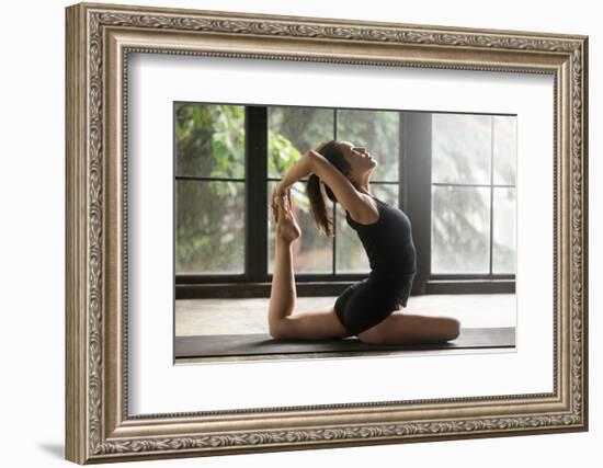 Young Woman Practicing Yoga, Stretching in One Legged King Pigeon Exercise, Eka Pada Rajakapotasana-fizkes-Framed Photographic Print