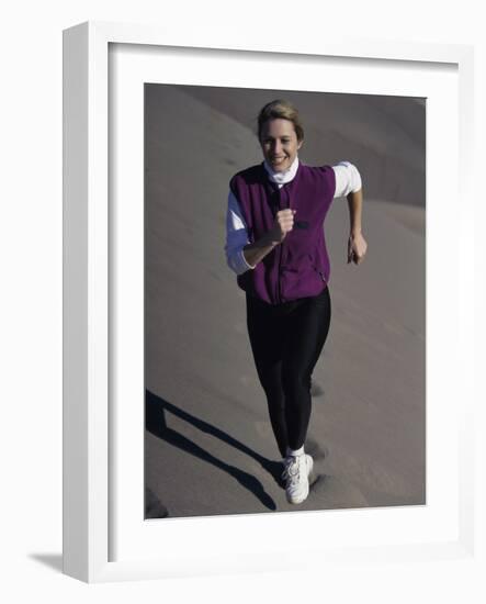 Young Woman Running Up a Sand Dune-null-Framed Photographic Print