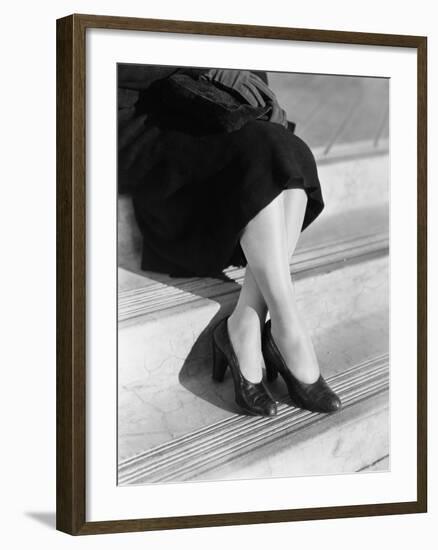 Young Woman's Legs in High Heels Sitting on a Step-null-Framed Photo