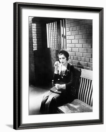 Young Woman Sitting N a Bench in Front of a Jail Cell-null-Framed Photo